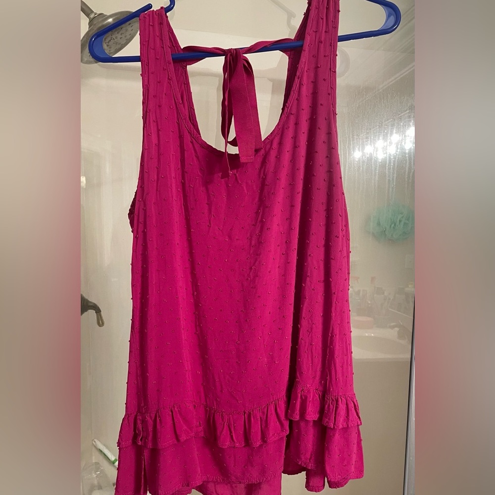 Large, bright top from a local boutique. Worn once.